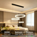 3-tier suspended circle crystal LED chandelier with 300mm, 400mm and 500mm crystal rings, warm glow in a modern dining room.