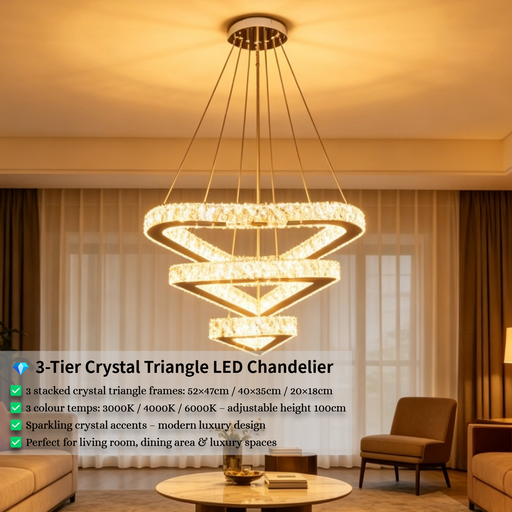3-tier silver crystal triangle LED chandelier suspended above a modern dining table, emitting warm white light – Mega Lighting