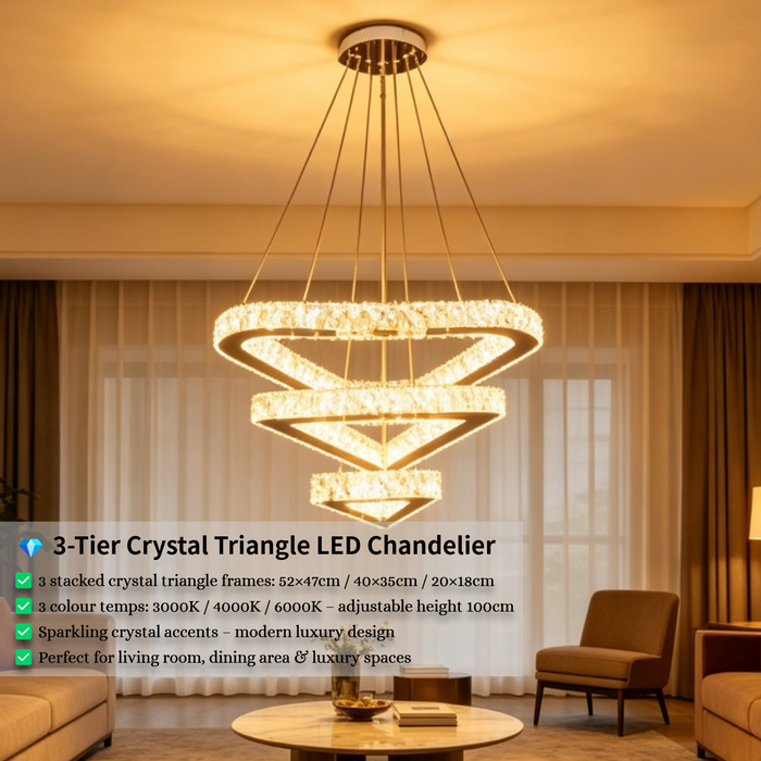 3-tier silver crystal triangle LED chandelier suspended above a modern dining table, emitting warm white light – Mega Lighting