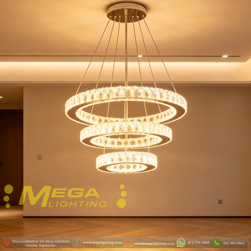 3-tier white circular LED ring chandelier suspended above a modern bed, emitting warm white light – Mega Lighting