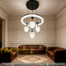 Black dual-layer crystal LED chandelier with 4 textured glass shades, installed in a minimalist European dining room with warm 3000K lighting.