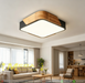 40x40cm square wood-frame ceiling light with natural wood grain and 4000K neutral white glow, installed in a modern living room.