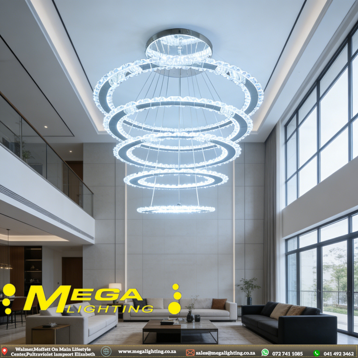 5-ring white LED pendant chandelier with cascading 30-60cm rings, warm glow above a modern dining table.