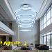 5-ring white LED pendant chandelier with cascading 30-60cm rings, warm glow above a modern dining table.