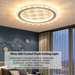 50cm LED crystal flush ceiling light with starburst pattern diffuser and petal-shaped crystal trim, installed in a modern bedroom with warm lighting.

