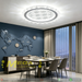 50cm LED crystal flush ceiling light with starburst pattern diffuser and petal-shaped crystal trim, installed in a modern bedroom with warm lighting.

