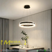 Black modern crystal ring LED pendant light, 50cm diameter, installed in a minimalist European dining room with warm 3000K lighting.