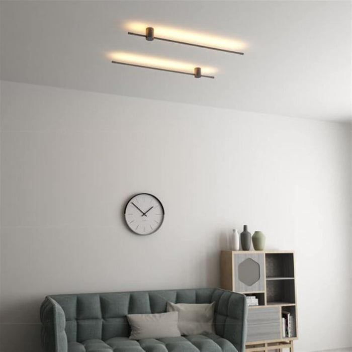 Minimalist 1.6cm thin profile LED wall sconce with round base, mounted beside a home office desk – Mega Lighting