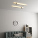 Minimalist 1.6cm thin profile LED wall sconce with round base, mounted beside a home office desk – Mega Lighting