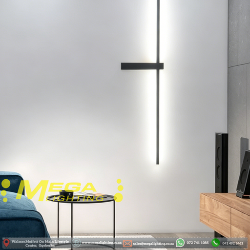 Modern geometric cross LED wall sconce with multi-directional glow, mounted in a hallway – Mega Lighting