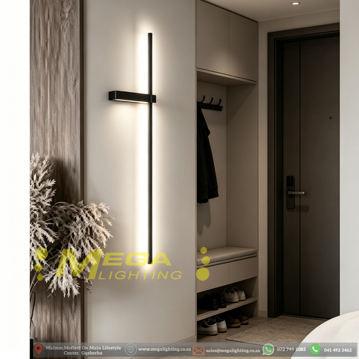 Modern geometric cross LED wall sconce with multi-directional glow, mounted in a hallway – Mega Lighting