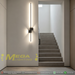 60cm matte black linear LED wall light installed on a living room wall, emitting warm white light – Mega Lighting
