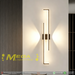 Modern 60cm black linear LED wall light installed on a bedroom wall, emitting warm white light – Mega Lighting