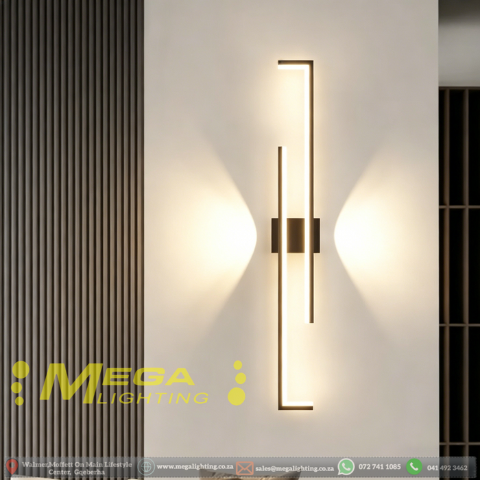 Modern 60cm black linear LED wall light installed on a bedroom wall, emitting warm white light – Mega Lighting