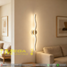 60cm black wavy LED wall light installed on a living room wall, emitting warm white light – Mega Lighting