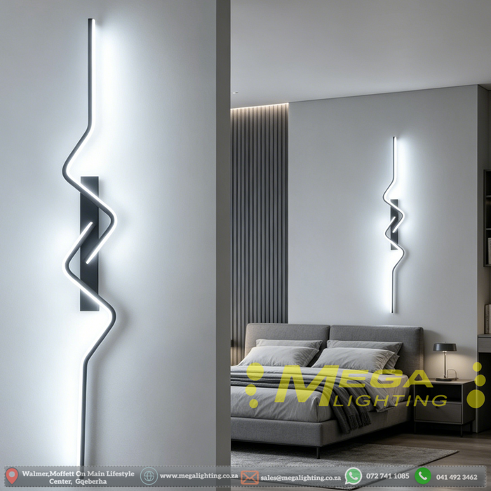 60cm matte black zig-zag wave LED wall light installed in a modern living room, emitting warm white light – Mega Lighting