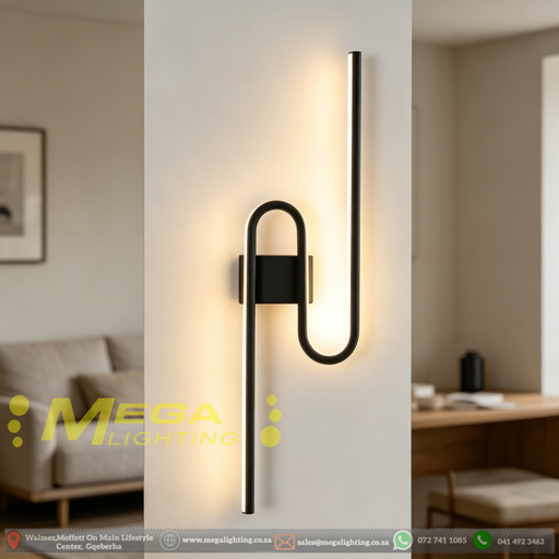 61cm matte black U-shaped looped LED wall light installed in a modern living room, emitting warm white light – Mega Lighting