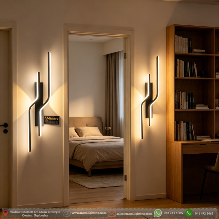 63cm matte black twisted dual-wavy LED wall light installed in a modern bedroom, emitting warm white light – Mega Lighting