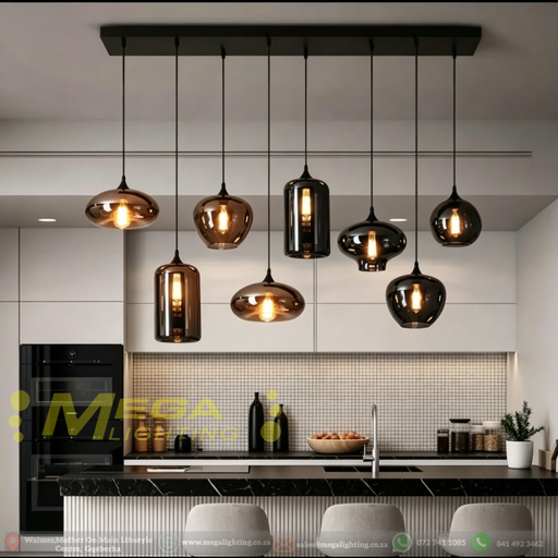 Modern linear pendant light with 8 mixed amber and smoked glass shades above a kitchen island – Mega Lighting