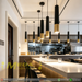 Black and gold cylinder pendant light with adjustable height and GU10 LED bulb, modern dining room lighting.