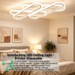 Interlocking design LED flush mount ceiling light in white finish, 52x13cm, warm glow in a modern living room.
