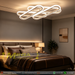 Interlocking design LED flush mount ceiling light in white finish, 52x13cm, warm glow in a modern living room.

