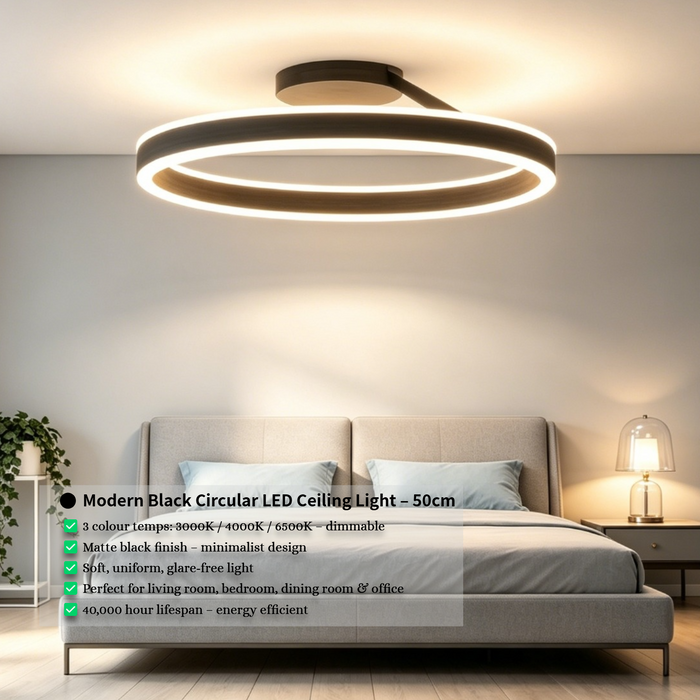 Black circular LED ceiling light with adjustable CCT (3000K/4000K/6500K) mounted in a modern dining room, minimalist design, 50cm diameter, South Africa.