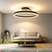 Black circular LED ceiling light with adjustable CCT (3000K/4000K/6500K) mounted in a modern dining room, minimalist design, 50cm diameter, South Africa.