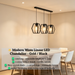 3-heads hexagon industrial pendant lamp with matte black frame and clear glass, 1m bar, suspended above kitchen island.