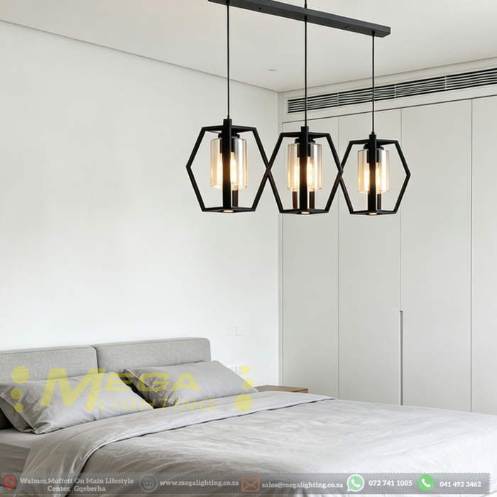 3-heads hexagon industrial pendant lamp with matte black frame and clear glass, 1m bar, suspended above kitchen island.