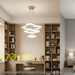 3-tier white cloud-shaped LED chandelier installed above a modern dining table, emitting warm white light – Mega Lighting