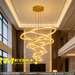 Modern 5-ring gold spiral LED chandelier suspended in a luxury villa living room with warm white lighting – Mega Lighting

