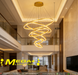 Modern 5-ring gold spiral LED chandelier suspended in a luxury villa living room with warm white lighting – Mega Lighting

