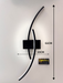 Modern 60cm black curved LED wall light installed on a staircase wall, emitting warm white light – Mega Lighting