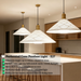 White perforated cone pendant light with brass accents, E27 bulb base, 100cm height, 35cm diameter, over modern bar and dining counter.