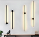 Minimalist 1.6cm thin profile LED wall sconce with round base, mounted beside a home office desk – Mega Lighting