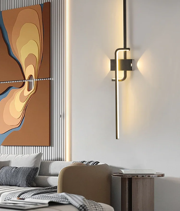 Sleek black curved LED wall light in cool white light, displayed in a minimalist living room – Mega Lighting