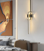 Sleek black curved LED wall light in cool white light, displayed in a minimalist living room – Mega Lighting
