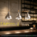 Scene alt: Single teardrop wooden connector pendant light above kitchen island, minimalist home decor lamp